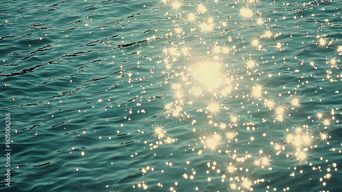 Sparkling water surface, sunlight reflecting on rippled teal water.  Detailed sparkles