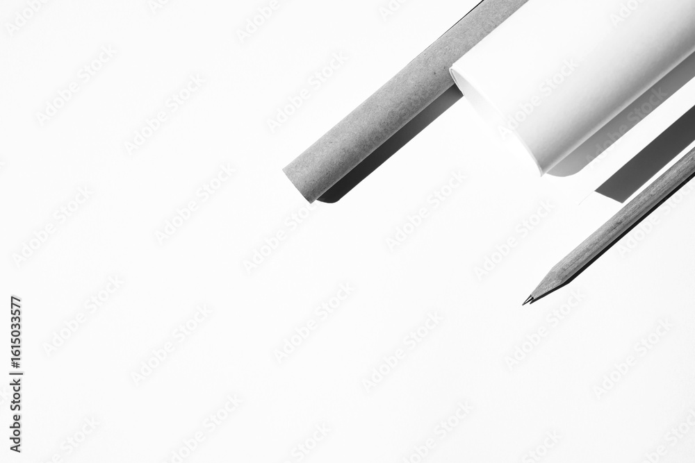 Fototapeta premium Layout of Paper Rolls, Graphite Crayon on White Desk. Architect Design Studio. 