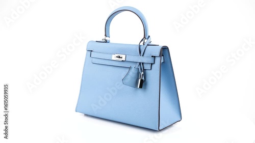 4K seamless video of a stylish light blue leather handbag spinning 360 degrees on a white background. Ideal for showcasing fashion products, digital marketing, or e-commerce stores.