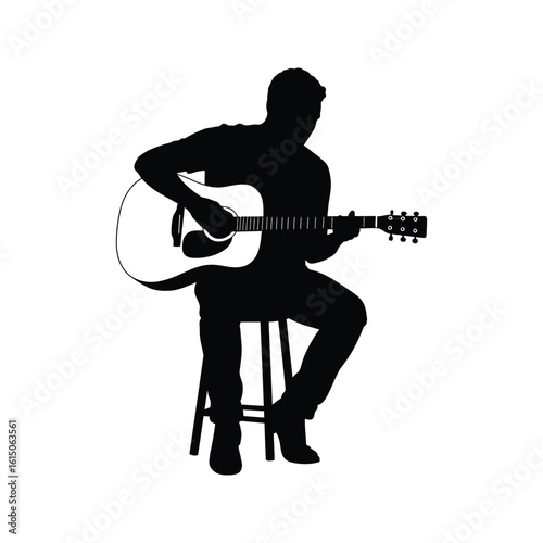 Silhouette of a man sitting and playing acoustic guitar music musician singer songwriter