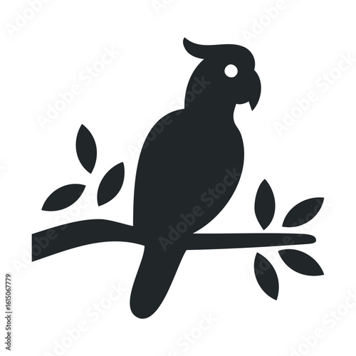 Silhouette of a cockatoo perched on a branch