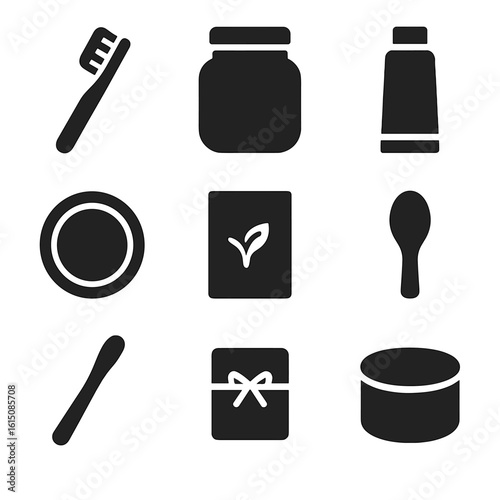 Eco Beauty Icon Set. Solid, filled icon set of eco beauty tools: bamboo brush, glass jar, refill tube, reusable pad, compostable
