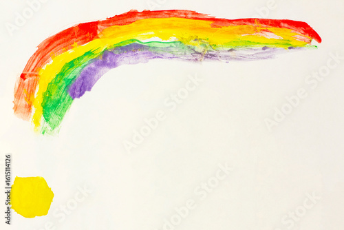 Rainbow and sun. Real drawing of a small child. Drawing by pencil.