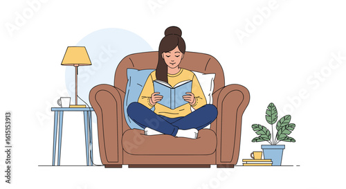 A woman sitting comfortably in a cozy armchair reading a book with a lamp and plant nearby