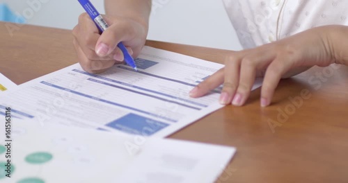 A focused student writes notes during a lesson showcasing dedication to learning.