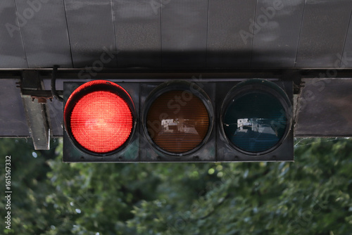 Horizontal traffic light with red light on.