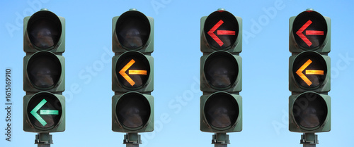 Sequence of a traffic light with left turn arrow: green, yellow, red and red + yellow light. Set of traffic lights with the sky as background.