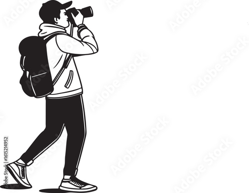 Silhouette of a Male Photographer with a Backpack Taking a Picture