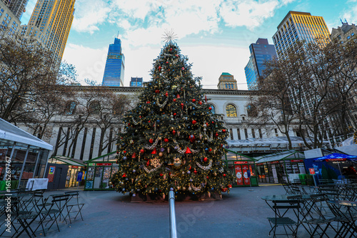 Huge Christmas tree at New York City's Bryant Park beneath city skyscrapers