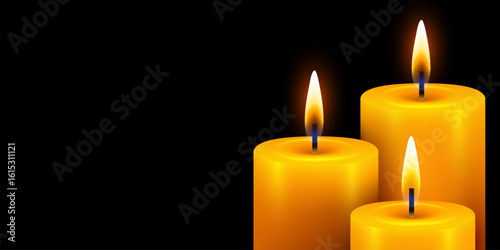 3 Burning candles. Yellow candle with golden flame on dark background.
