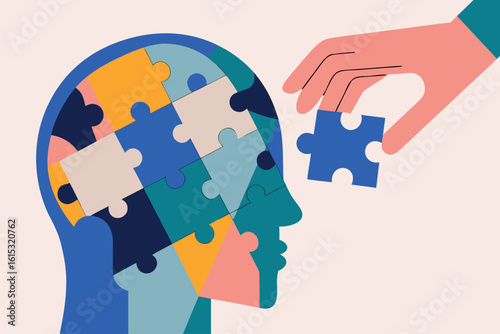 Koncepcja zdrowia psychicznego i terapii. Ręka wkłada ostatni element puzzli do głowy, symbolizując rozwiązanie problemu i leczenie.