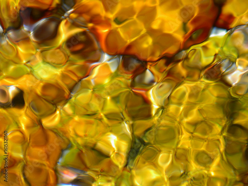 An illustrative image of the physical phenomena of reflection and refraction of light when it hits water with a multicoloured back