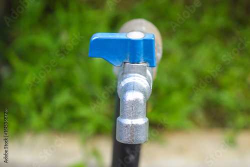 Photography blue combination chrome water faucet outdoor blurred background