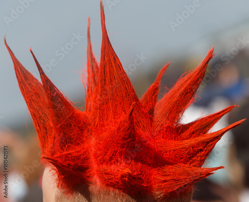 Fotografija A person with red hair has a red spikey hairstyle