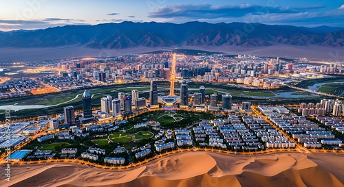 Fototapeta Naklejka Na Ścianę i Meble -  Panoramic aerial view of Ordos, a modern city in Inner Mongolia, China against mountain range at