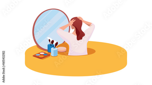 Woman arranging her hair in front of a mirror with makeup and brushes on a yellow vanity table top