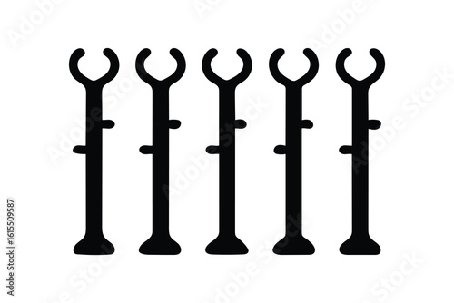 Five identical black plastic plant support stakes with adjustable clips arranged in a row on a white background