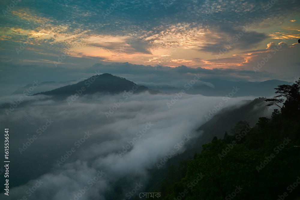 Obraz premium Scenic Darjeeling hill station showcasing tea gardens, Himalayan views, and colonial architecture. Famous Indian mountain destination with toy train and sunrise vistas.