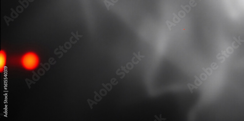 Dark abstract image with smoke and fog creating a mysterious, ethereal atmosphere.