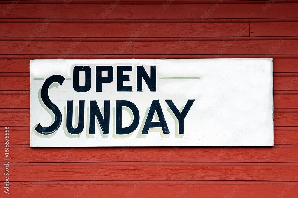 Open Sunday Sign at store front Open Sunday Sign at store front