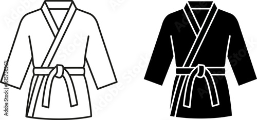 Two martial arts gi outfits one white one black with belts