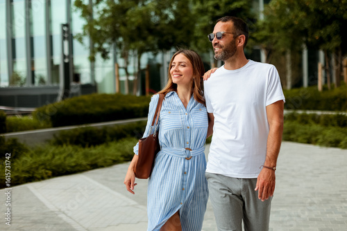 Couple enjoys a sunny strol...