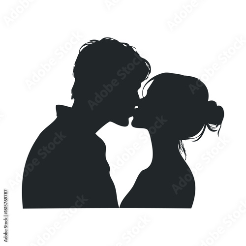 Silhouette of young caucasian couple kissing in romantic embrace