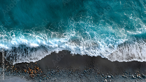 Turquoise Ocean Waves Crashing On Pebble Beach water