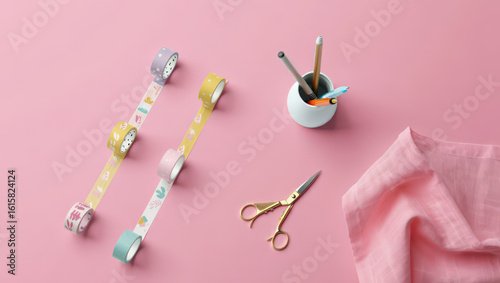 Top-Down View of Decorative Tapes, Stationery Holder, Scissors, and Cloth on Pink Surface for Crafting, Scrapbooking, and Creative Projects with Pastel Colors and Clean Aesthetic
