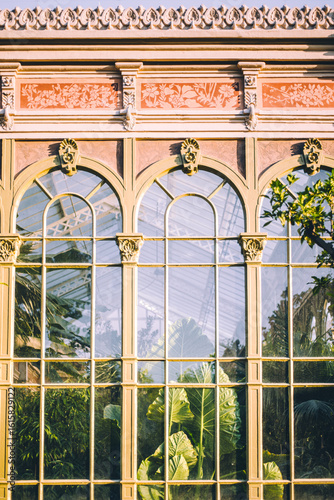 Historic Hivernacle glasshouse exterior with tropical plants in Parc de la Ciutadella, Barcelona