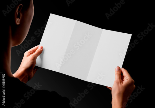 Person Holding a Blank White Tri-Fold Brochure Mockup