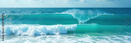 Vibrant blue-green sea, rolling waves, whitecaps , coast, wave pattern