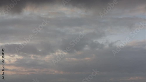 Time lapse. Rain clouds quickly move away from the foreground and a bright post-storm sky opens up