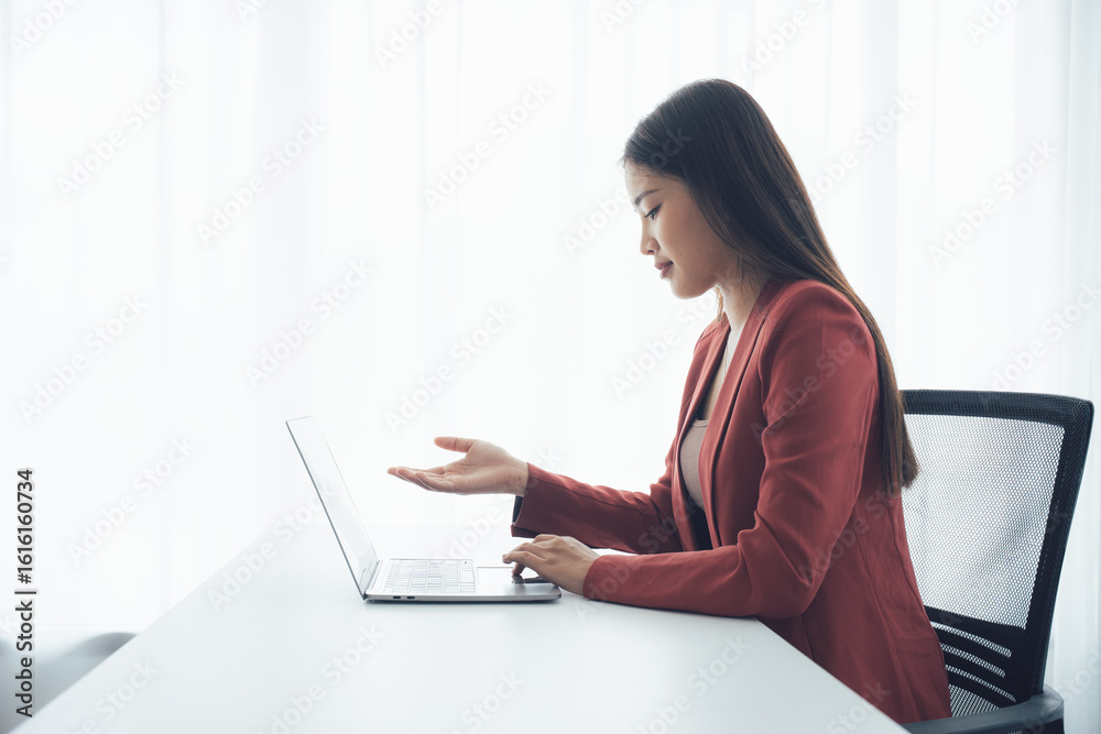 Digital Harmony: A poised professional woman with flowing hair, engrossed in a laptop, radiating sophistication and digital acumen. Digital Harmony: A poised professional woman with flowing hair, engrossed in a laptop, radiating sophistication and digital acumen.