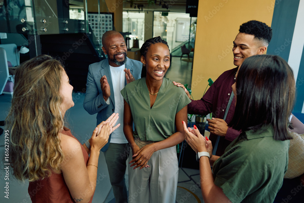Φωτογραφία Group of diverse coworkers applauding black businesswoman in office during dayti