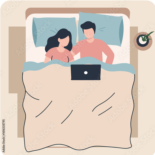 Couple relaxing in bed with laptop and blanket at home  