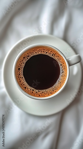 Freshly Brewed Coffee Served in a White Cup on a Soft White Surface