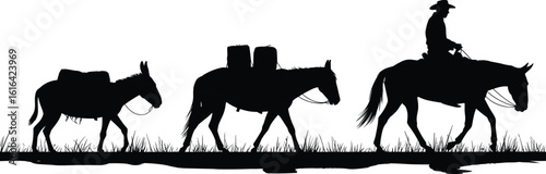 Silhouette of cowboy riding horse leading pack animals with cargo through grassy trail, vintage western travel and rural transport scene