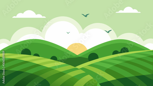 Green rolling hills meet a vibrant blue sky in this idyllic summer landscape with meadows and trees
