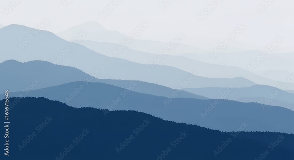 Obraz premium Layers of blue mountains fade into the distance