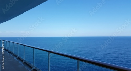 A Serene View of the Deep Blue Ocean from a High-Rise Balcony on a Clear Day