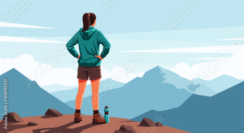 A hiker stands on a mountain peak, admiring the vast, serene landscape.