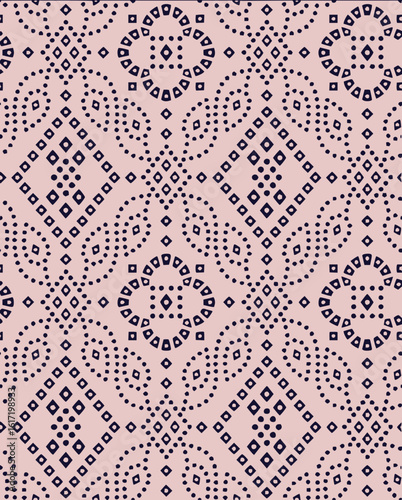 Repeating pattern of dark blue diamonds circles and dots on a light pink background creates a textile design
