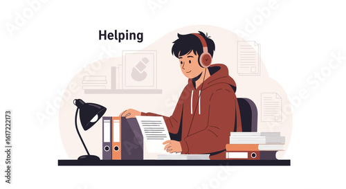 A young man helping by reviewing documents wearing headphones in an office setting