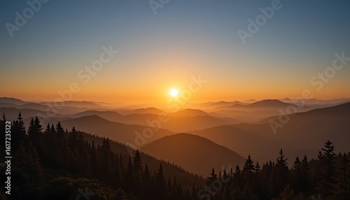 Majestic Sunrise Over Rolling Mountain Ranges and Silhouetted Pine Trees