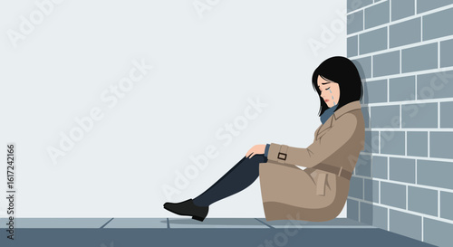 Lonely Woman In Trench Coat Sitting Depressed Against A Brick Wall