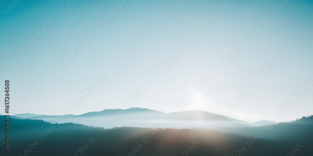 Fototapeta premium Misty mountain range bathed in soft light