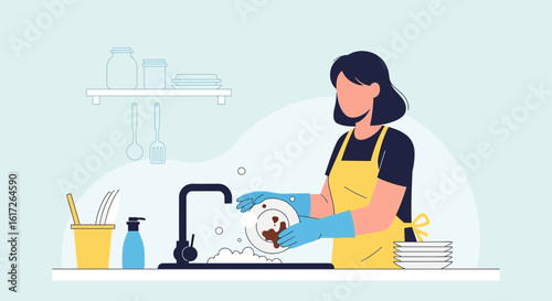 Woman With Apron Washing Dishes At The Sink Inside Her Kitchen At Home