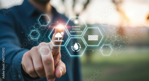 Person interacting with climate change adaptation icons on a digital interface outdoors at daytime