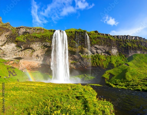 Majestic waterfall cascading down a rocky cliff face